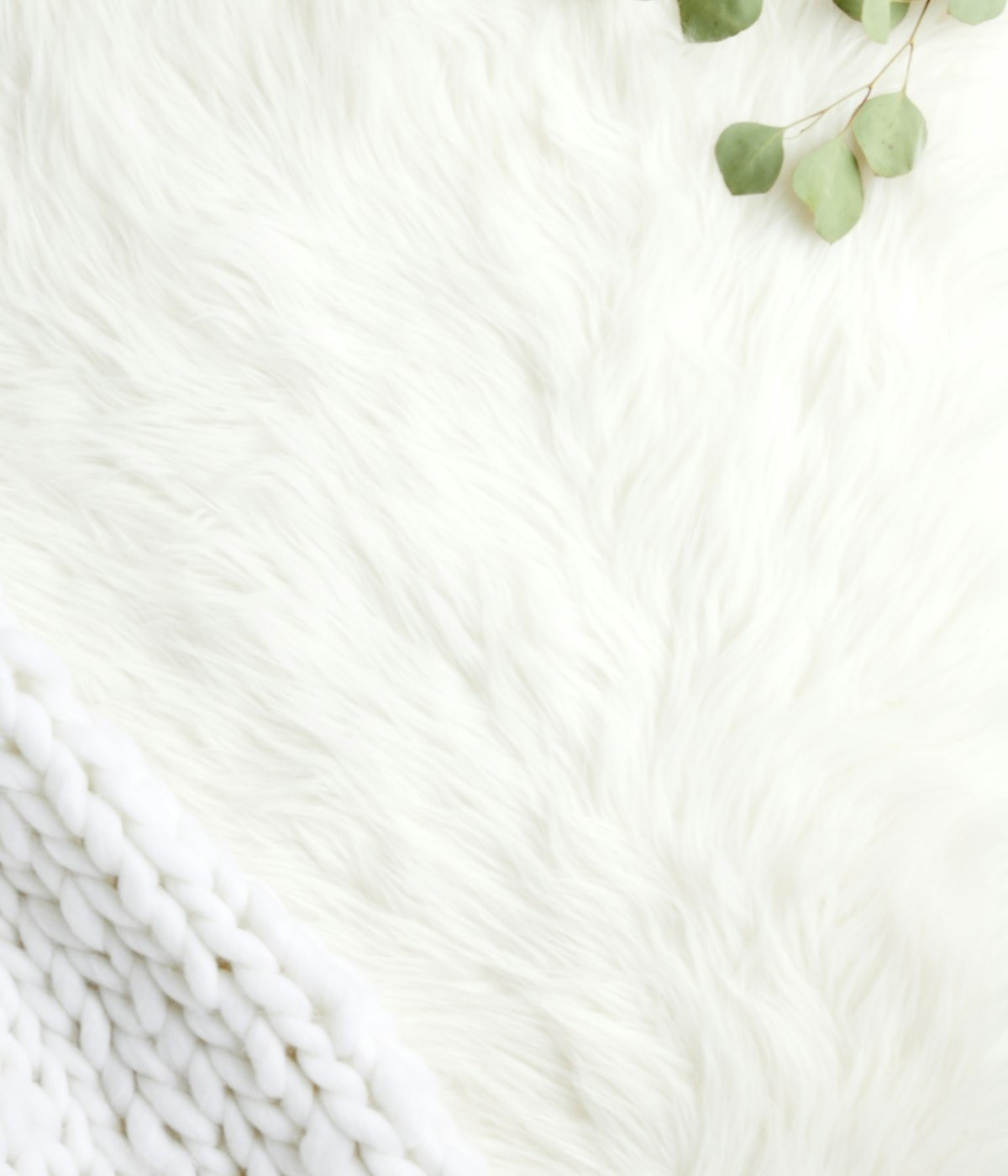 White high-pile woolen rug filling the frame